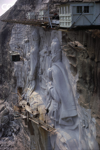ca. 1968, Atlanta, Georgia, USA --- Carving in Progress at Stone Mountain --- Image by © James L. Amos/Corbis